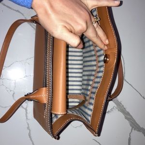 Dooney and Bourke shoulder purse only used once. Phone and key chain accessory.